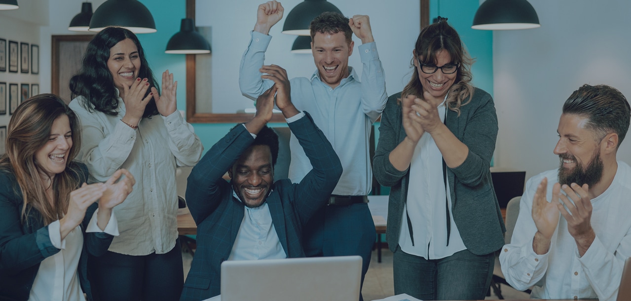 People in an office celebrating